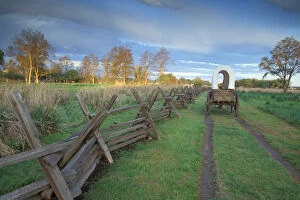 A replica wagon at sunrise along the Original Oregon Trail found at Whitman Mission