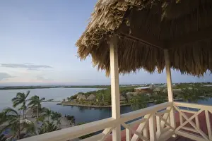 Images Dated 14th November 2006: Resort hotels and Caribbean Sea, viewed from roof with thatched palapa, Placencia