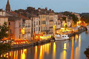 Images Dated 14th June 2006: Restaurants along the l Herault river. L Herault river. A fishing boat. Agde town