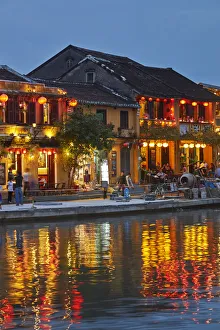 Dark Prints: Restaurants reflected in Thu Bon River at dusk, Hoi An (UNESCO World Heritage Site)