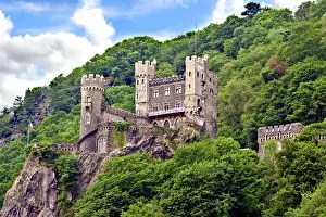 Riverside Prints: Rheinland-Pflaz, Germany, Castle Rheinstein stands on a cliff looking down to