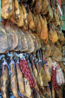 Hang Prints: Rhonda, Spain. Legs of Jamon Iberico hanging for sale in local shop