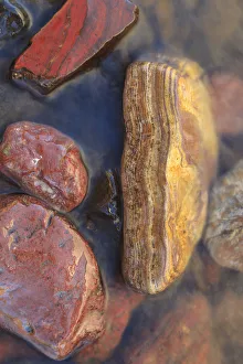 River rocks naturally polished in Lower Deschutes River, Central Oregon, USA