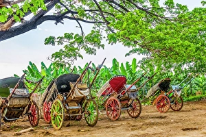 Ferry Prints: Riverside, Myanmar. Portrait of rickshaws along the riverside waiting for customers arriving from the ferry
