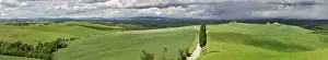 Winding Road Prints: Road winding through agricultural region of Tuscany with storm clouds, Italy