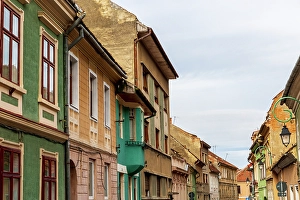 Transylvania Prints: Romania Brasov. 16th century arcaded, and terra cotta roofed houses and narrow streets