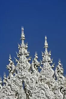 Images Dated 22nd February 2006: Rooftop architectural details of the new all white temple of Wat Rong Khun in Tambon
