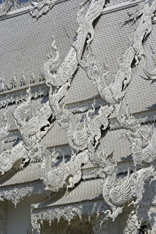 Images Dated 22nd February 2006: Rooftop architectural details of the new all white temple of Wat Rong Khun in Tambon
