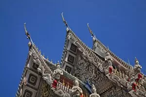 Rooftop architectural details, Wat Suan Plu, Bangkok, Thailand