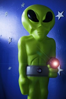 Alien Prints: Roswell, New Mexico, United States. Green alien with ray run for sale in local store