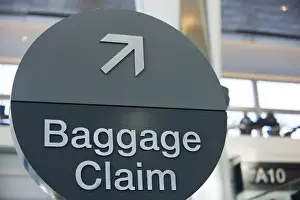Point Prints: A round Baggage Claim sign at San Francisco International airport - San Francisco