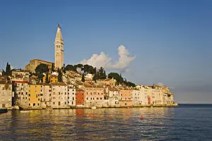 Images Dated 16th May 2007: Rovigno skyline and Cathedral of St. Euphemia reflected on Adriatic Sea at sunrise