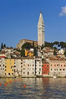 Rovigno skyline and Cathedral of St. Euphemia reflected on Adriatic Sea at sunrise