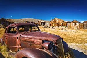 State Park Prints: Rusted car and buildings, Bodie State Historic Park, California USA