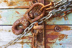 Aqua Prints: Rusty lock and chain on light blue wood