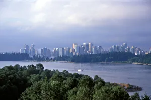 Images Dated 7th April 2005: Sail boat on the river in front of the skyline of the city of Vancouver, British Columbia