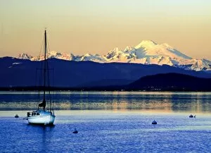 Sailboat anchored on Camano Island is swarfed by Mt. Baker