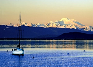 Images Dated 15th November 2007: Sailboat anchored on Camano Island is swarfed by Mt. Baker