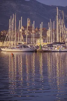 Reflect Prints: Sailboat masts light up in the early morning light in Korculas Eastern Harbor