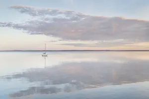 Still Prints: Sailboat and morning clouds reflected in calm waters of Bellingham Bay, Washington State