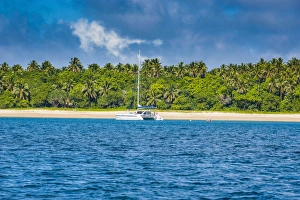 Tonga Prints: Sailing boat anchoring on the white sand beach of Haa'apai, Haapai, islands, Tonga