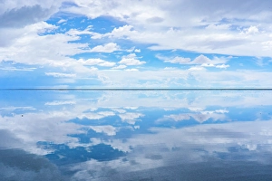 Bolivia Prints: Salar de Uyuni, Bolivia. Wide angle landscape view of clouds reflecting over the Salar de Uyuni