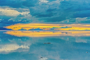 Bolivia Prints: Salar de Uyuni, Bolivia. Wide angle landscape view of sun setting after the rain over the world's largest salt flat