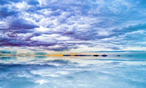 Hanging Prints: Salar de Uyuni, Bolivia. Wide angle landscape view at sunset of clouds hanging over the Salar de Uyuni