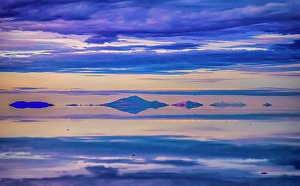 Hanging Prints: Salar de Uyuni, Bolivia. Wide angle landscape view at sunset of clouds over the Salar de Uyuni