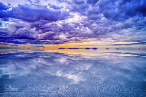 Hanging Prints: Salar de Uyuni, Bolivia. Wide angle landscape view at sunset of clouds over the Salar de Uyuni