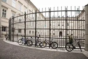 Enclosure Prints: Salzburg, Salzburg, Austria - Bicycles parked against a tall, wrough-iron fence