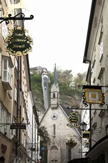 Low Angle Prints: Salzburg, Salzburg, Austria - Low angle view of an old world church. Buildings are