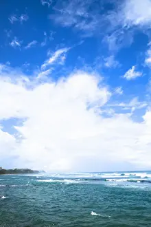Secluded Prints: San Juan, Puerto Rico - Waves are coming onto the beach of a tropical island. Vertical