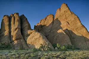 Sandstone rising from the desert floor, Arches National Park, Utah, USA