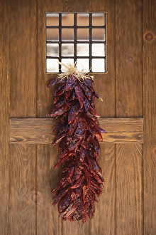 Images Dated 13th July 2011: Santa Fe, New Mexico, United States. Traditional chile ristra hangs from door