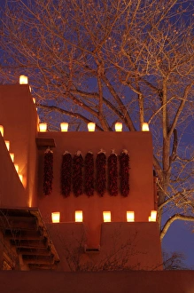 Images Dated 28th December 2011: Santa Fe, New Mexico, United States. Tradional farolitos light up adobe structures