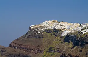 Santorini Greece and the beautiful white buildings on the mountain cliffs of main