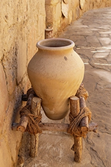Saudi Arabia Prints: Saudi Arabia, Tabuk Province, Tayma. An amphora on a stand at a desert oasis