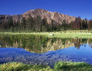 Sawtooth Mountains reflected in Fourth of July Lake, Idaho, USA