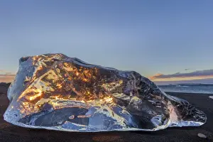 Jokulsarlon Prints: Scattered ice from icebergs on black sand beach at Joklusarlon, Iceland