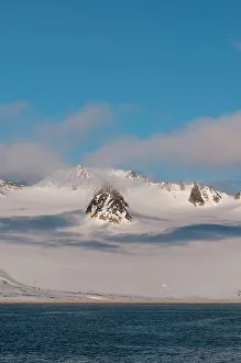 Polar Prints: A scenic view of the ice covered mountains surrounding Magdalenefjorden