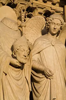Catholic Prints: Sculpture on facade of Notre Dame Cathedral of Saint Denis after his martyrdom by decapitation