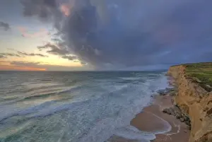 Images Dated 10th May 2010: Sea cliffs catch days last light at Pomponi State Beach in San Mateo County, California