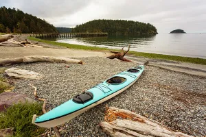 Danita Delimont New Images May 2025 Prints: Sea kayak on the shore of Bowman Bay, Deception Pass State Park, Washington State, USA