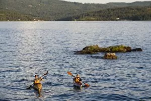 Sea kayakers on Lake Coeur d Alene in Idaho No real estate or resort use allowed (MR)