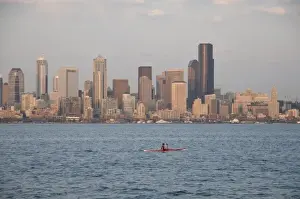 E O Reed Prints: Seattle skyline and waterfront viewed from West Seattle across Elliott Bay