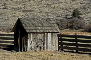 Shed and wheel, James Cant Ranch, John Day Fossil Beds, Oregon, USA Shed and wheel, James Cant Ranch, John Day Fossil Beds, Oregon, USA
