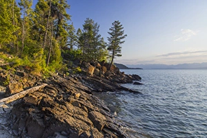 Lakeside Prints: Shoreline of Flathead Lake receives sunrise light at West Shore State Park near Lakeside