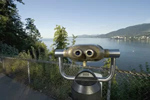 Sightseeing binoculars overlooking Burrard Inlet and Lions Gate Bridge from Prospect Point