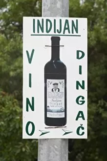 Images Dated 8th July 2006: Sign advertising Indijan Vino Dingac, the Indian Winery. Potmje village, Dingac wine region